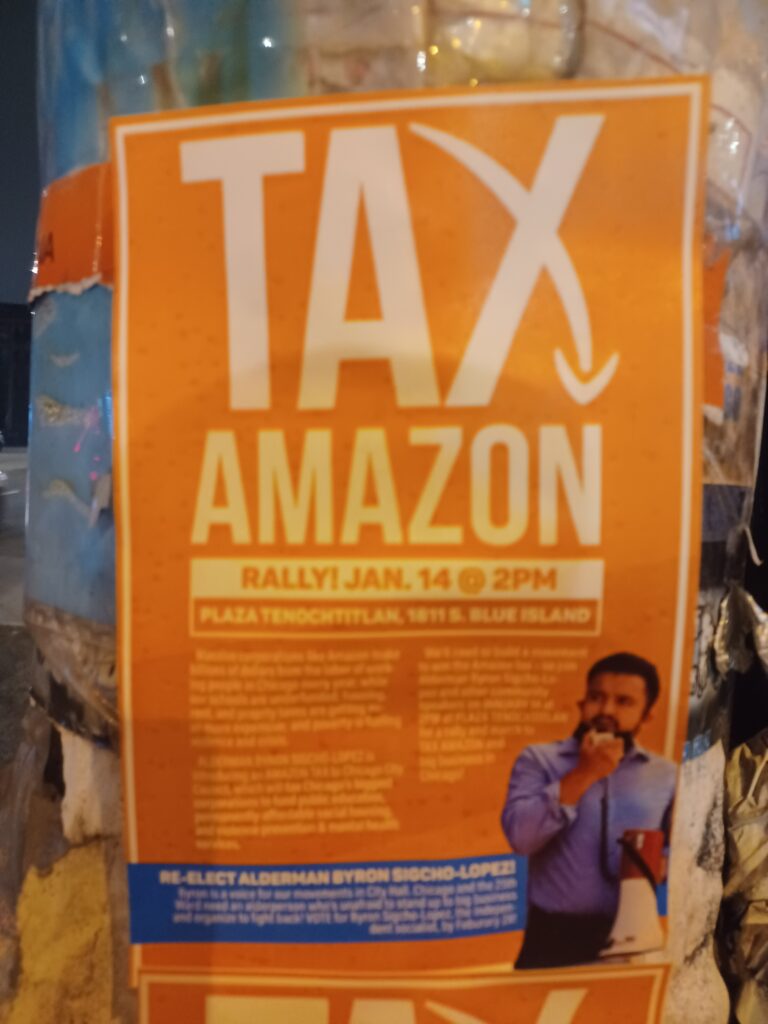 Alt: orange fly-posted flyer for the January 14, 2023 rally featuring Byron Sigcho-Lopez.