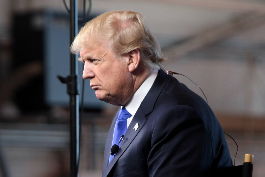 Donald Trump looks stern in profile.