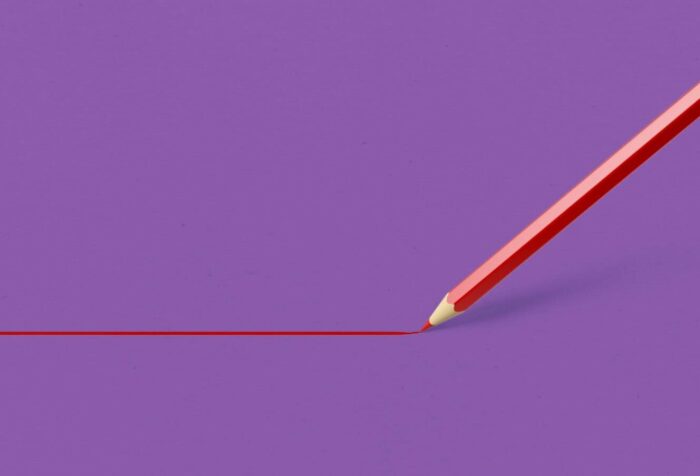 A solid purple background, with a red pencil drawing a line from the left to the right.