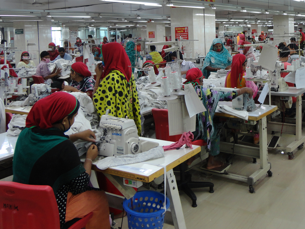 Women at sewing machines in a garment factory.