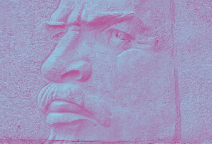 A zoomed-in picture on the face of a statue of Lenin.