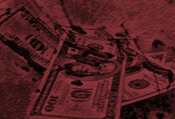 A photo of hundred-dollar bills, covered with a dark red filter.