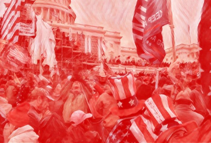 A red-filtered photo of a crowd of people in front of the Capitol building holding and wearing American flag and Trump regalia.