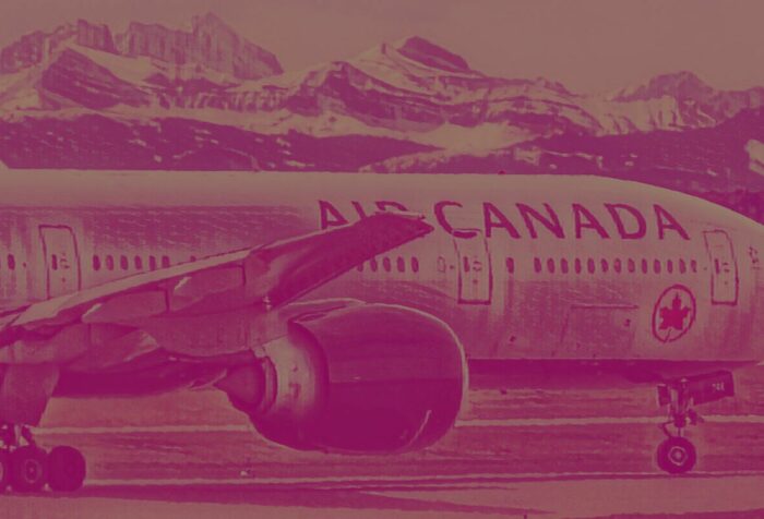A photo of an Air Canada plane on a runway.