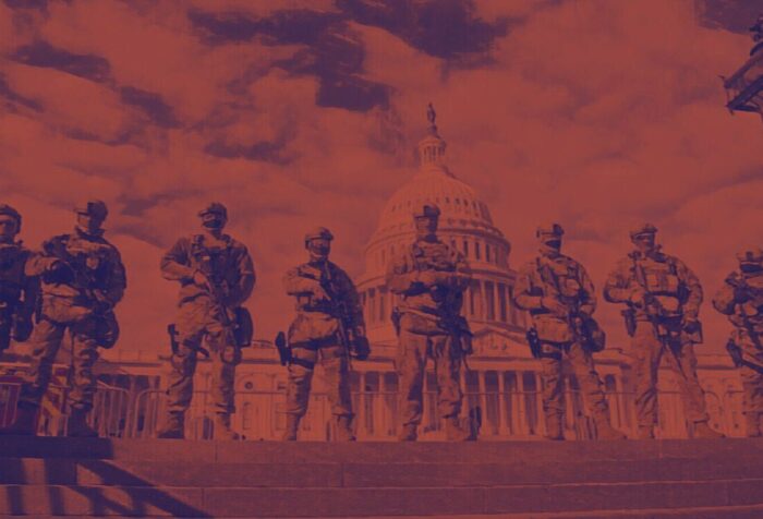 A photo of a line of soldiers standing in front of the Capitol building.