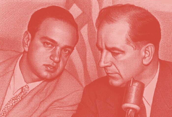 A photo of two men in suits, Joseph McCarthy and Roy Cohn, leaning together, talking. The photo has a red filter over it.