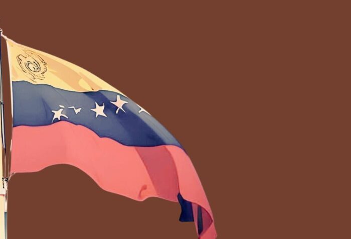 A waving flag of Venezuela against a brown background.