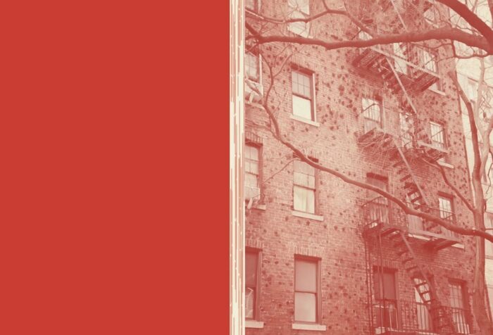 Against a red background, a photo of an apartment building with fire escapes.