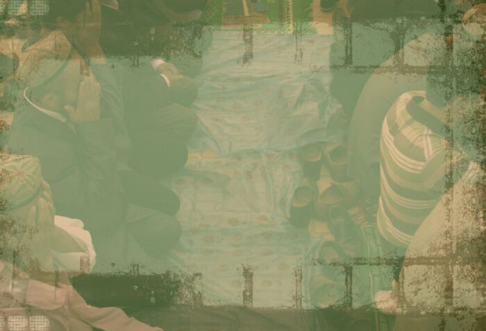 A hazy green photo of people praying.