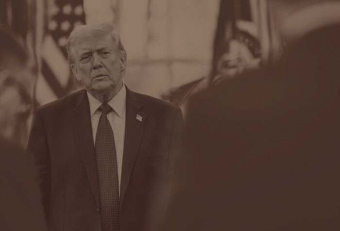 A black and white photo of Trump with his head cocked to the side.