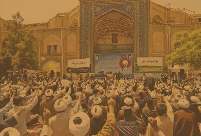 A crowd of people facing signs written in Persian.