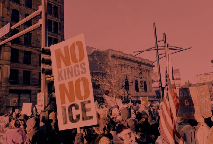 A crowd of protestors holding signs with slogans like "No Kings No ICE"